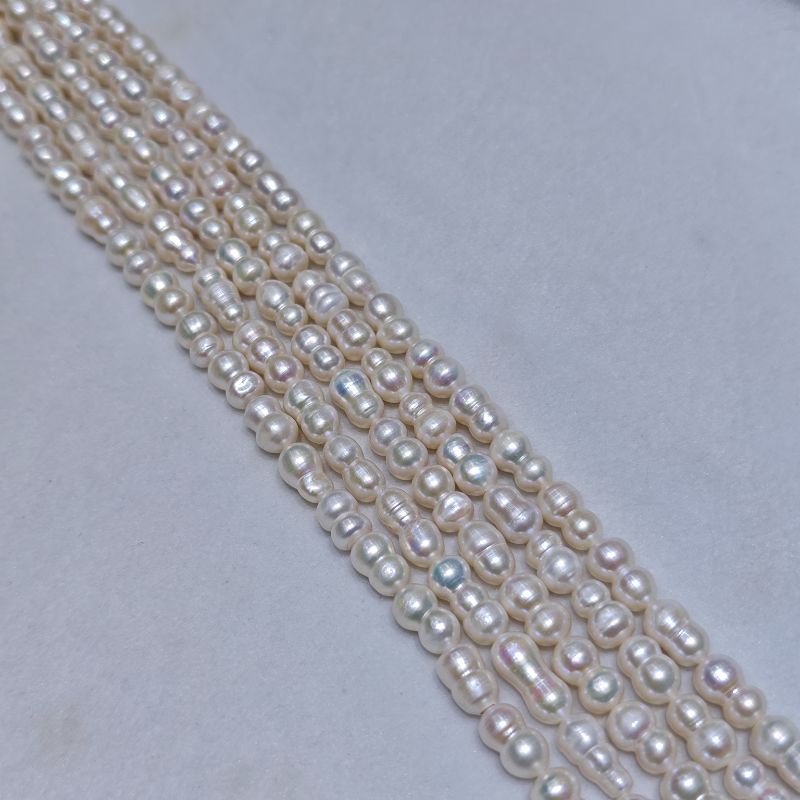 Filo di perle d'acqua dolce Barocche di nocciola bianca da 10-11mm | Grado AAAA Ingrosso in Cina 2 Filo di perle d'acqua dolce Barocche di nocciola bianca da 10-11mm | Grado AAAA Ingrosso in Cina - Produttore di Perle